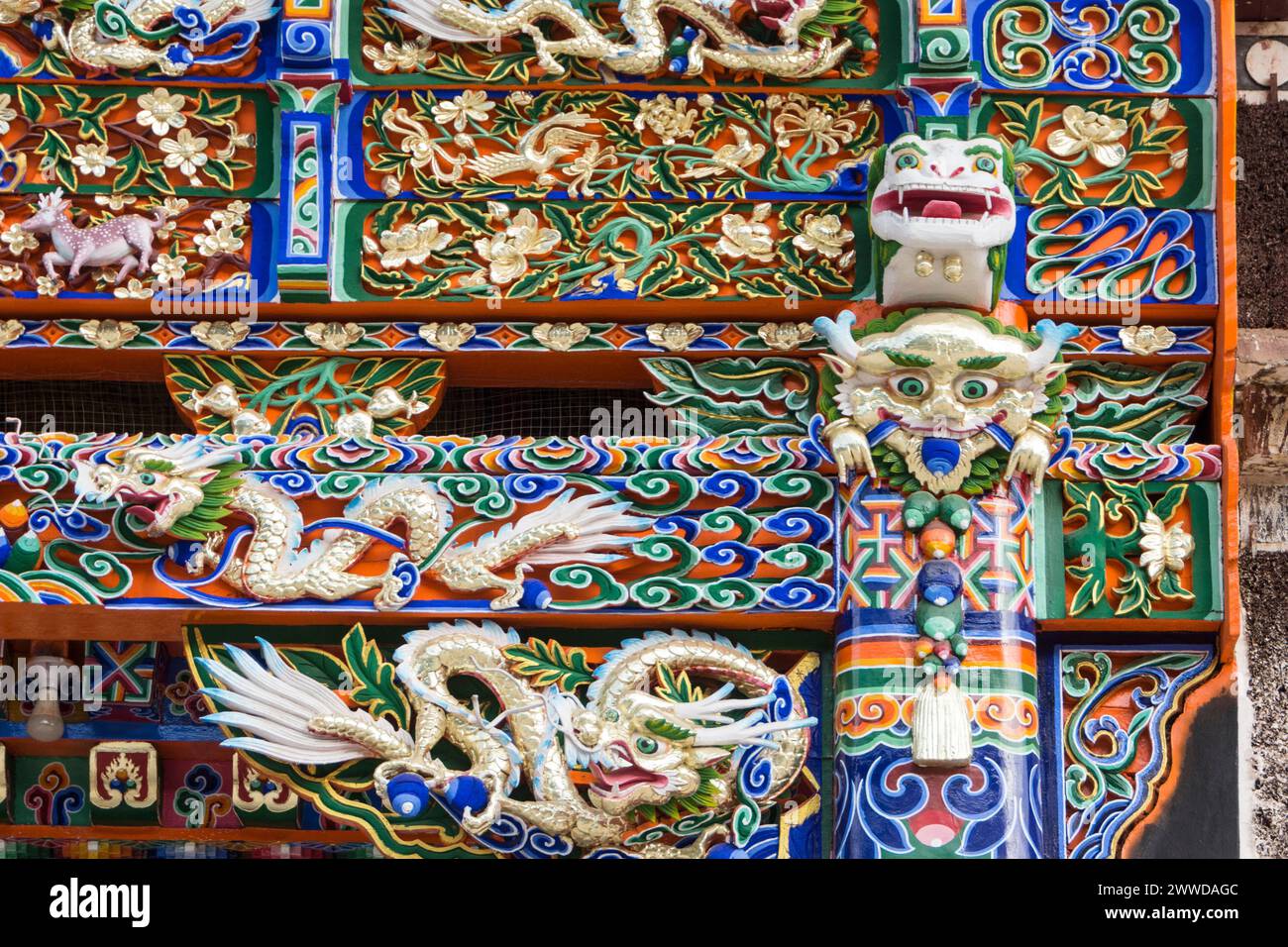 Detail of the elaborately decorated entrance of a temple in the Labrang monastery, Xiahe County, Gannan Tibetan Autonomous Prefecture, Gansu, China Stock Photo