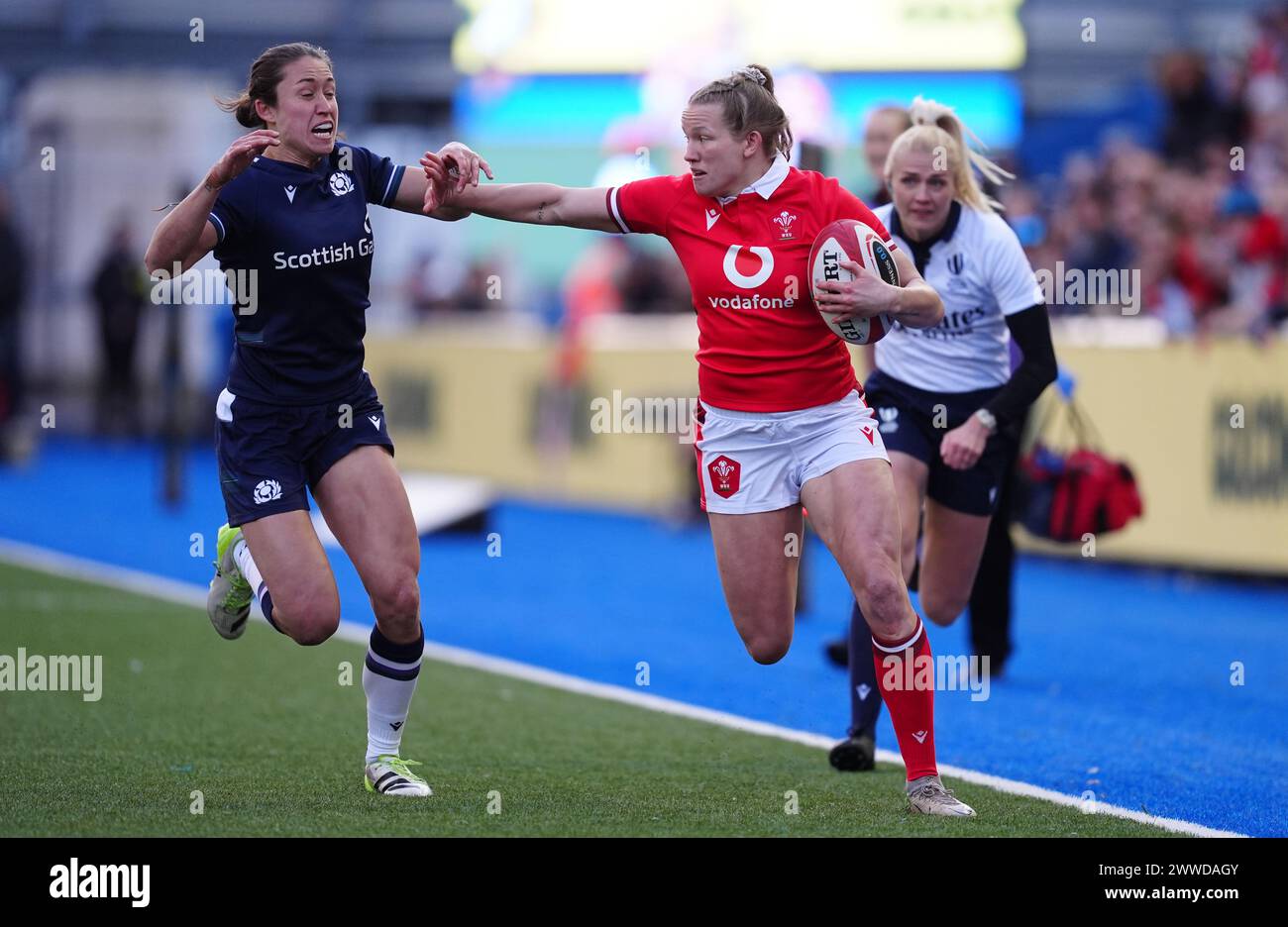 Wales Carys Cox hands off Scotlands Rhona Lloyd during the Women's Six Nations match at Cardiff Arms Park, Cardiff. Picture date: Saturday March 23, 2024. Stock Photo