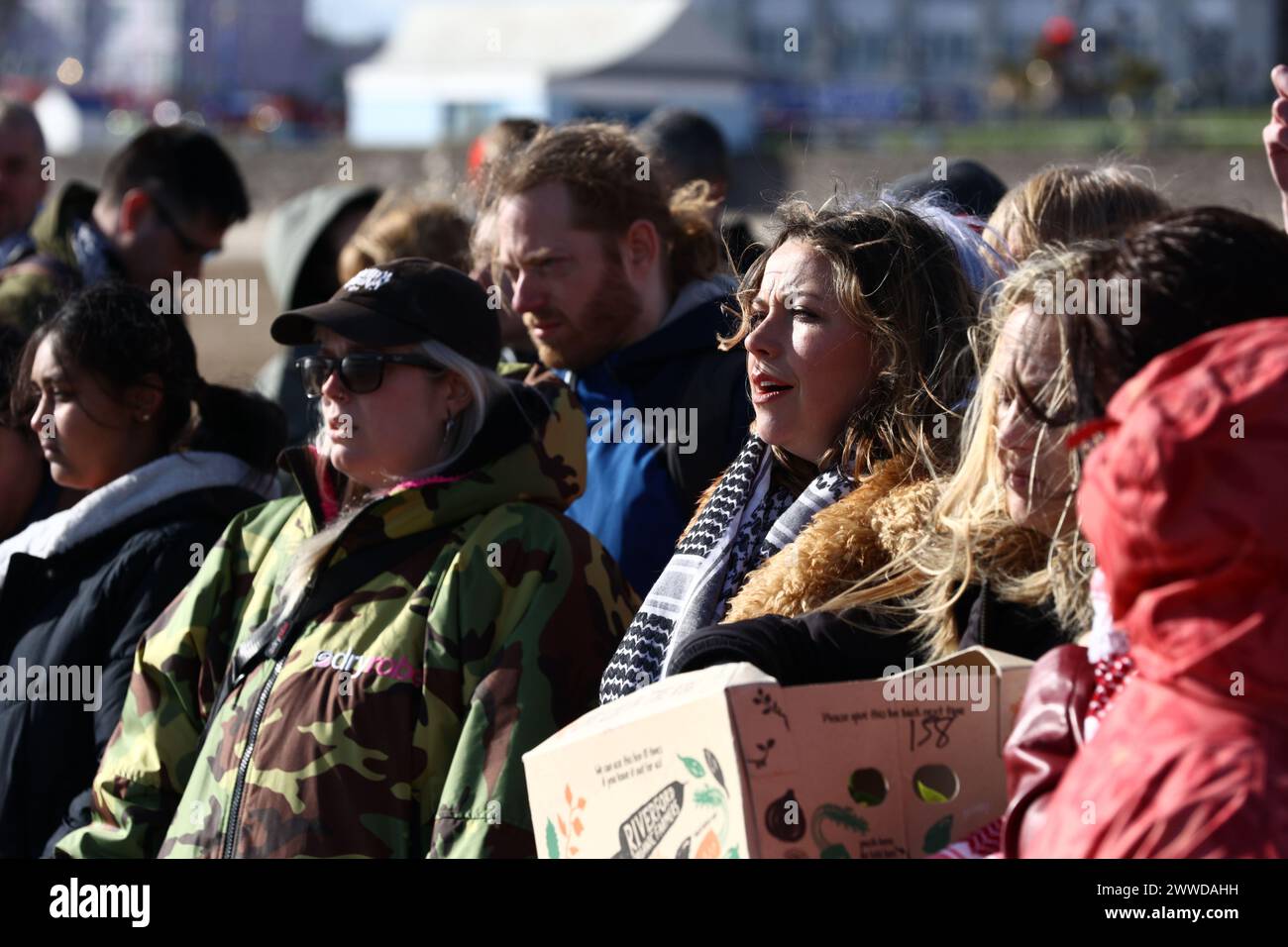 Barry Island, South Wales, UK. 23 March 2024.  Charlotte Church and a group of people the promenade at 2pm, in support of Gaza.  They sang songs and raised money for the Middle East Children's Alliance.  They also threw flowers in the sea.   Credit: Andrew Bartlett/Alamy Live News Stock Photo