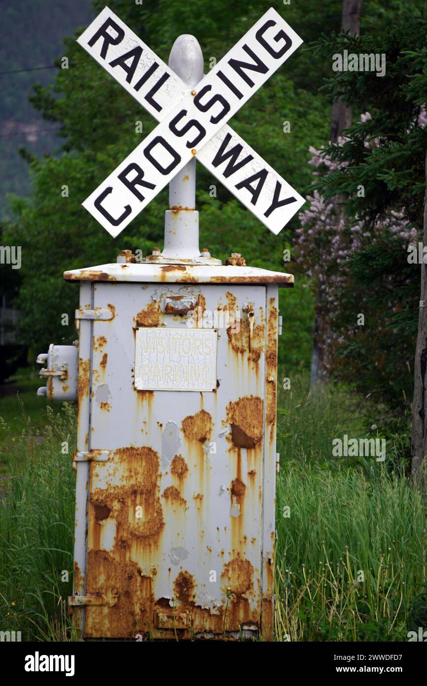 Railway crossing sign on a rusty post in rural Newfoundland Stock Photo ...