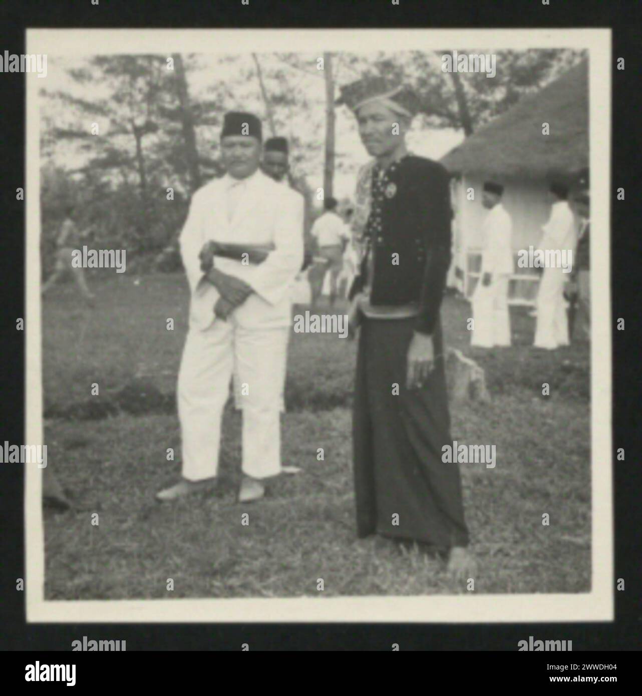 The image shows O.T. Hassan with native chief Badil of the Bajau ...