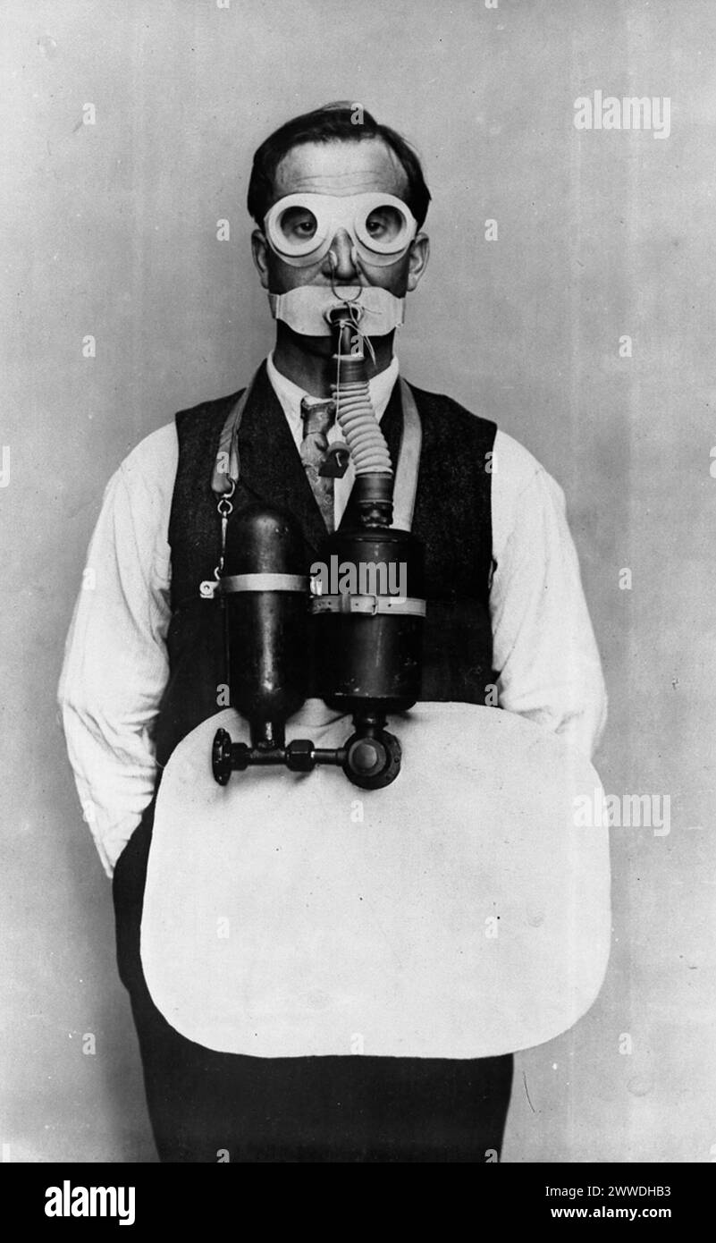 Gas Defence Description: Photograph from the Trench Warfare Section of the Ministry of Munitions showing a man wearing breathing apparatus against gas attack. Date: World War One mask, wwi, goggles, gas, gasmask, poison, firstworldwar, apparatus, mustardgas, nervegas, gasattack, trenchwarfare, ministryofmunitions Stock Photo