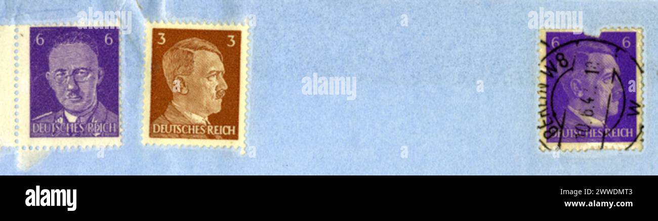 British Himmler Stamp Description: The stamp on the left is a fake. Only Adolf Hitler's portrait was permitted on German stamps but British agents produced these Himmler stamps in order to destablise the Nazi regime by suggesting that SS Leader Heinrich Himmler was plotting a coup and these stamps had leaked out early. Date: World War Two stamps, wwii, soe, philately, secondworldwar, himmler, specialoperationsexecutive Stock Photo