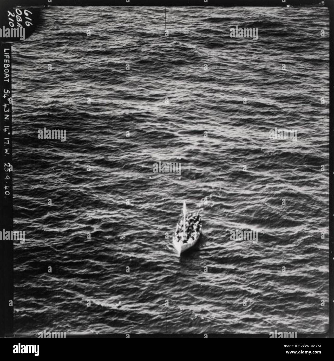 Awaiting Rescue Description: Aerial photograph of lifeboat from the SS City of Benares. The passenger liner was carrying children being evacuated from Britain to Canada when it was sunk in a U-Boat attack on the convoy in which it was travelling. Only 13 of the 90 children on board survived and government evacuation of children to the Dominions such as Canada, New Zealand and Australia (the CORB scheme) immediately ceased. Date: 25th September 1940 sea, rescue, ship, evacuation, atlantic, lifeboat, corb, airministry, ellermanlines, u48, ssmarina, sscityofbenares, cityofbenares, childrensoverse Stock Photo