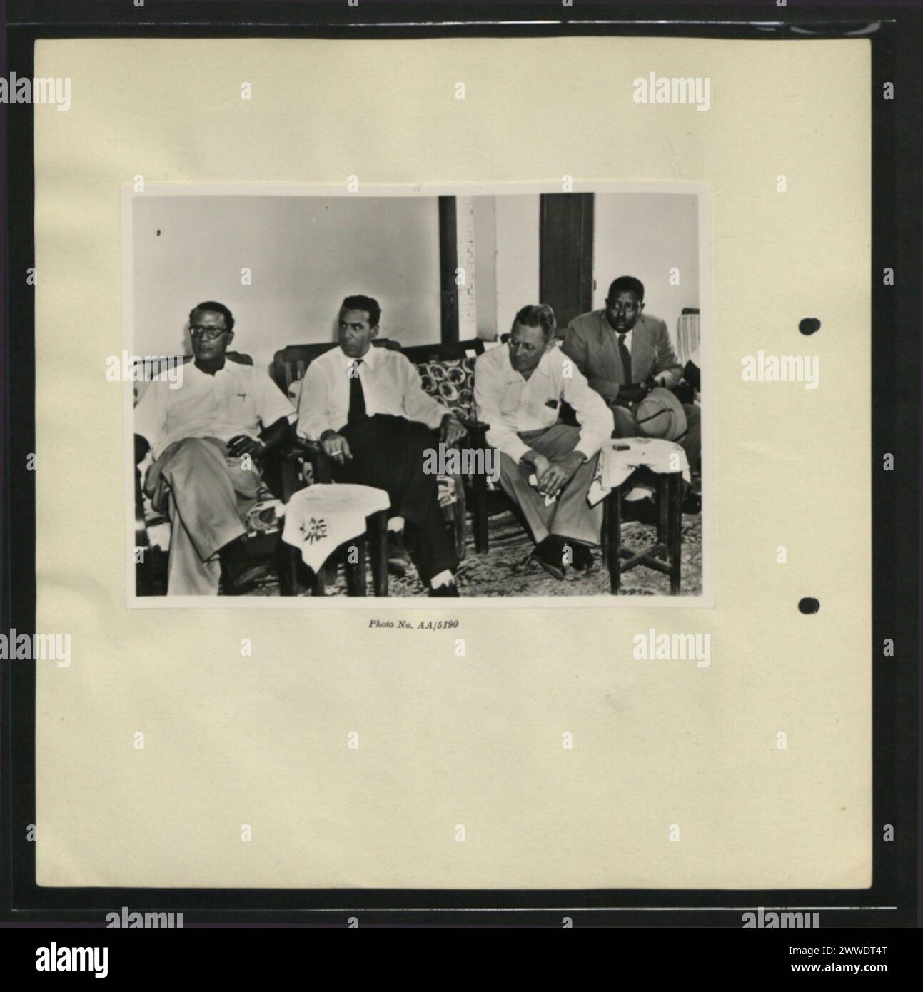 Description: Four members of Commission, Mr Sukumar Sen (Indian member), Colonel Abd el Fatteh (Egyptian member), Mr Warwick Perkins (US member) and El Sayed Mirghani el Amin (Chief Electoral Officer for Kassala Province), watch a trial of polling station procedure arranged for them. Location: Sudan Date: June 1953 africa, sukumarsen Stock Photo