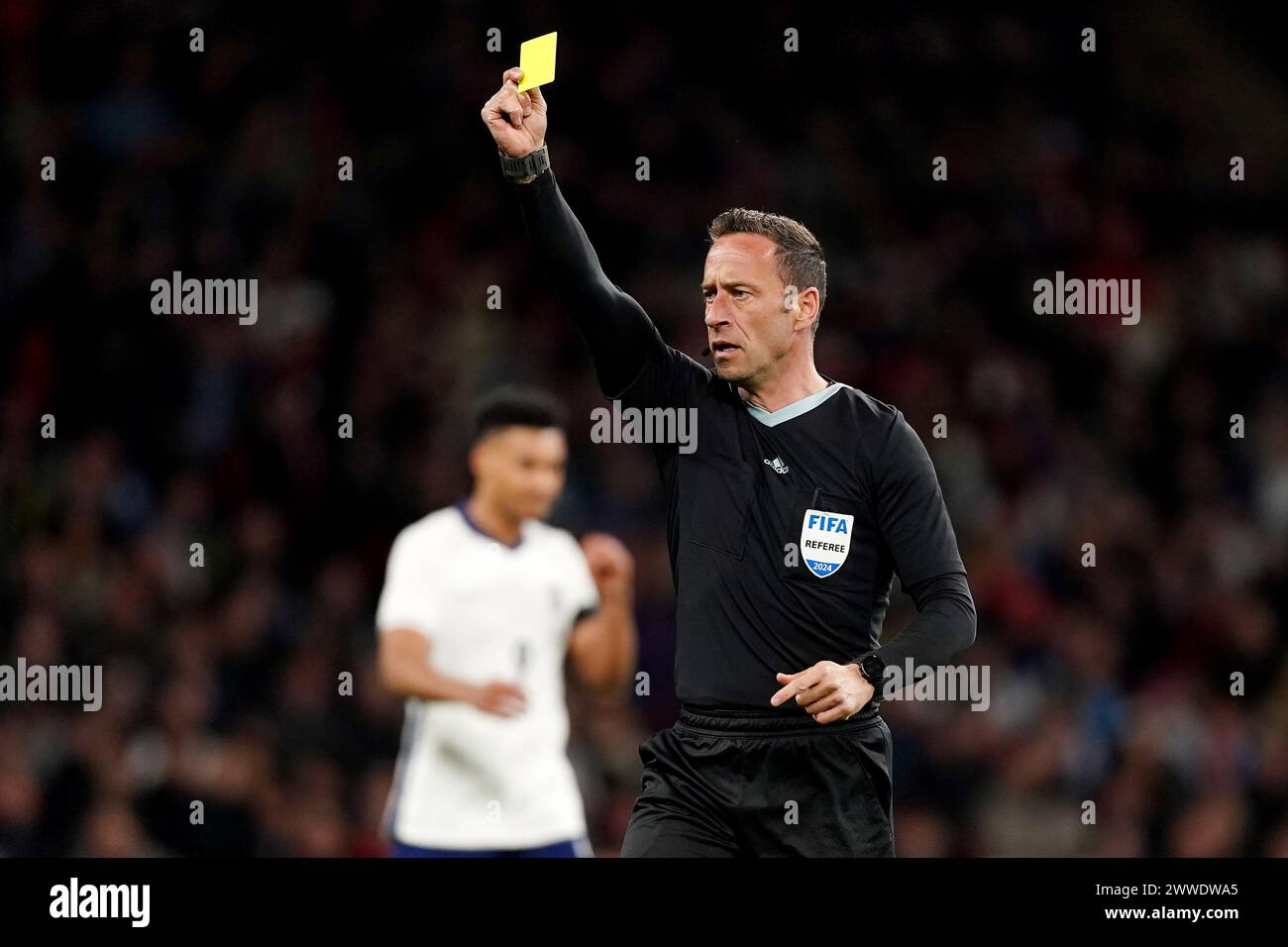England's Jude Bellingham (not pictured) is shown a yellow card by Match referee Artur Manuel Soares Dias during the international friendly match at Wembley Stadium, London. Picture date: Saturday March 23, 2024. Stock Photo