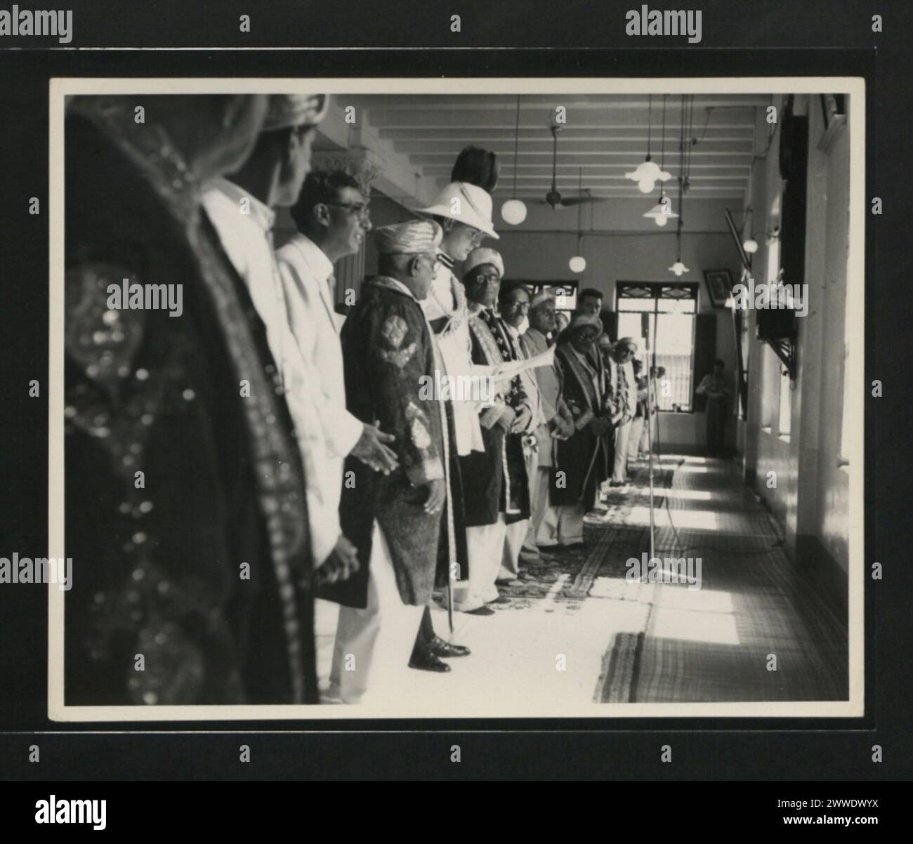 Description: Prayers for Her Majesty being said at the Jamat Khana ...