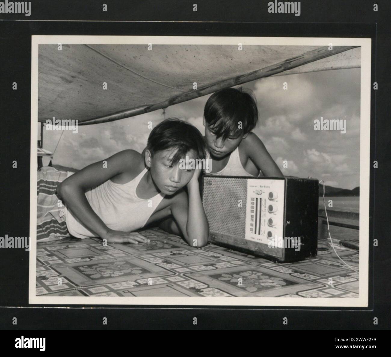 Listening to the radio in the family hi-res stock photography and