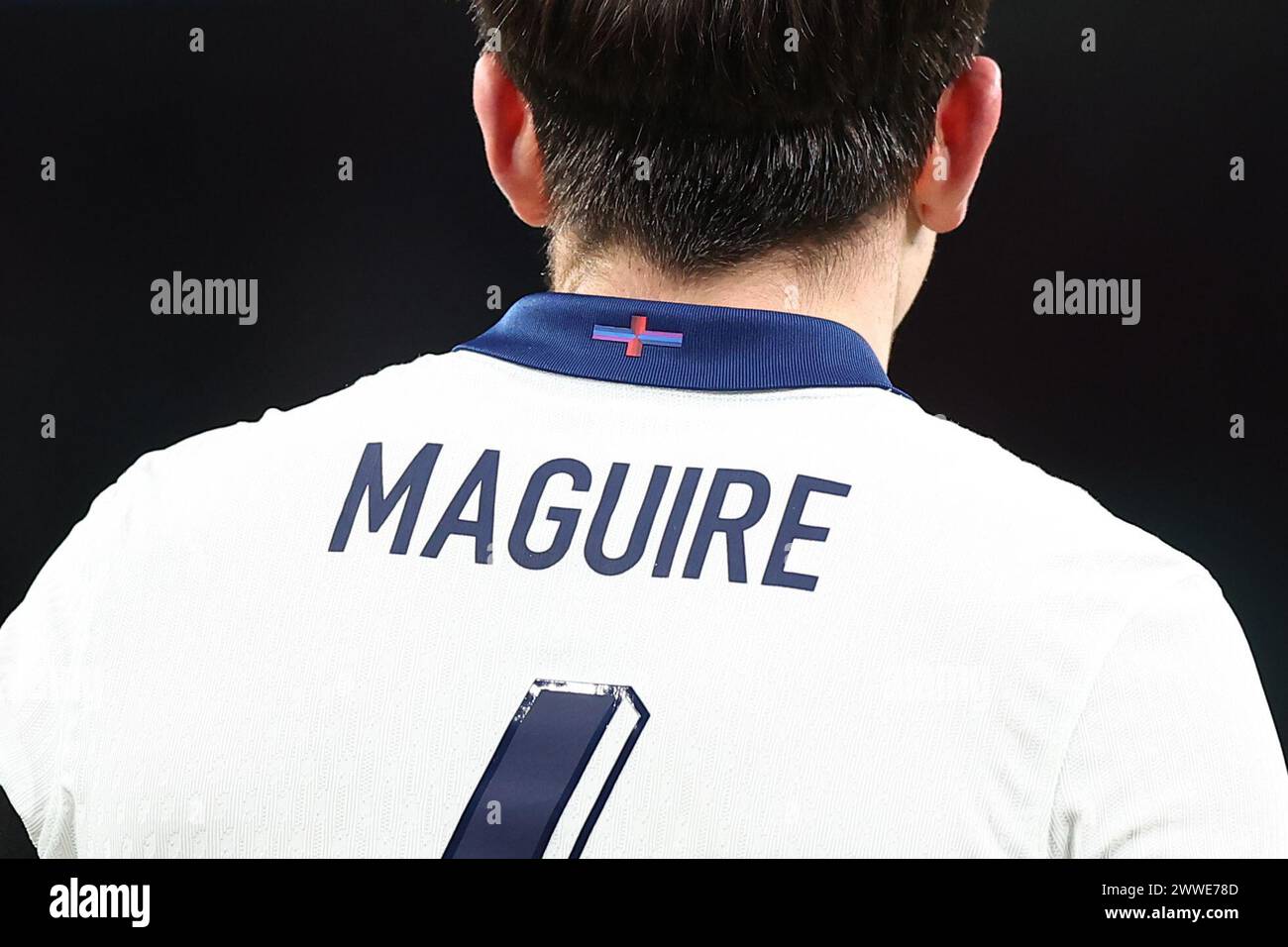 London, UK. 23rd Mar, 2024. The controversial flag on the collar of the England shirt is seen on the back of Harry Maguire of England during the International Friendly match between England and Brazil at Wembley Stadium on March 23rd 2024 in London, England. (Photo by Daniel Chesterton/phcimages.com) Credit: PHC Images LTD/Alamy Live News Stock Photo