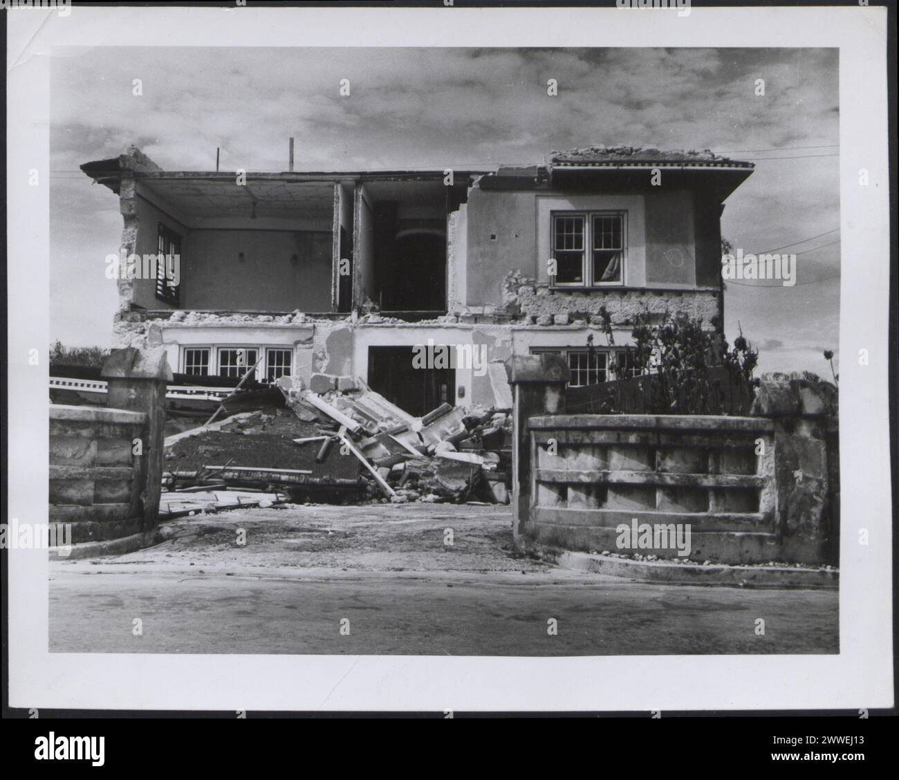 Santa Nita, a mansion opposite Hastings Rocks in Barbados, lost its roof and sustained wall damage during Hurricane Janet in 1955. Stock Photo