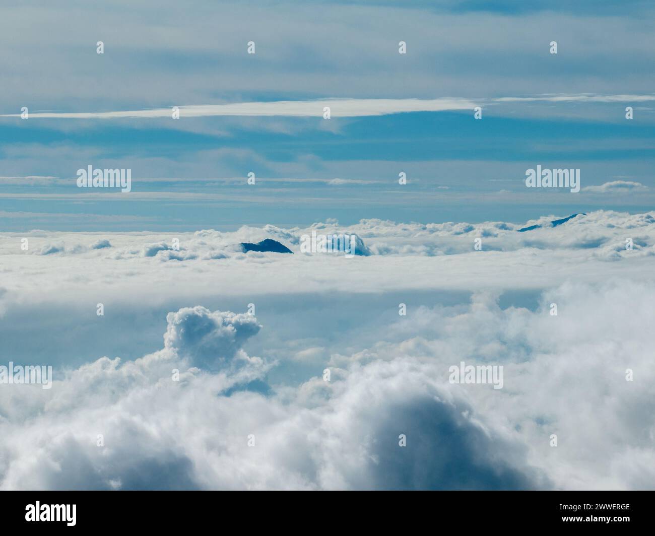 Aerial view of the peaks of Himalaya from Nagarkot, Nepal. A sea of clouds and Himalayan peaks towering out Stock Photo