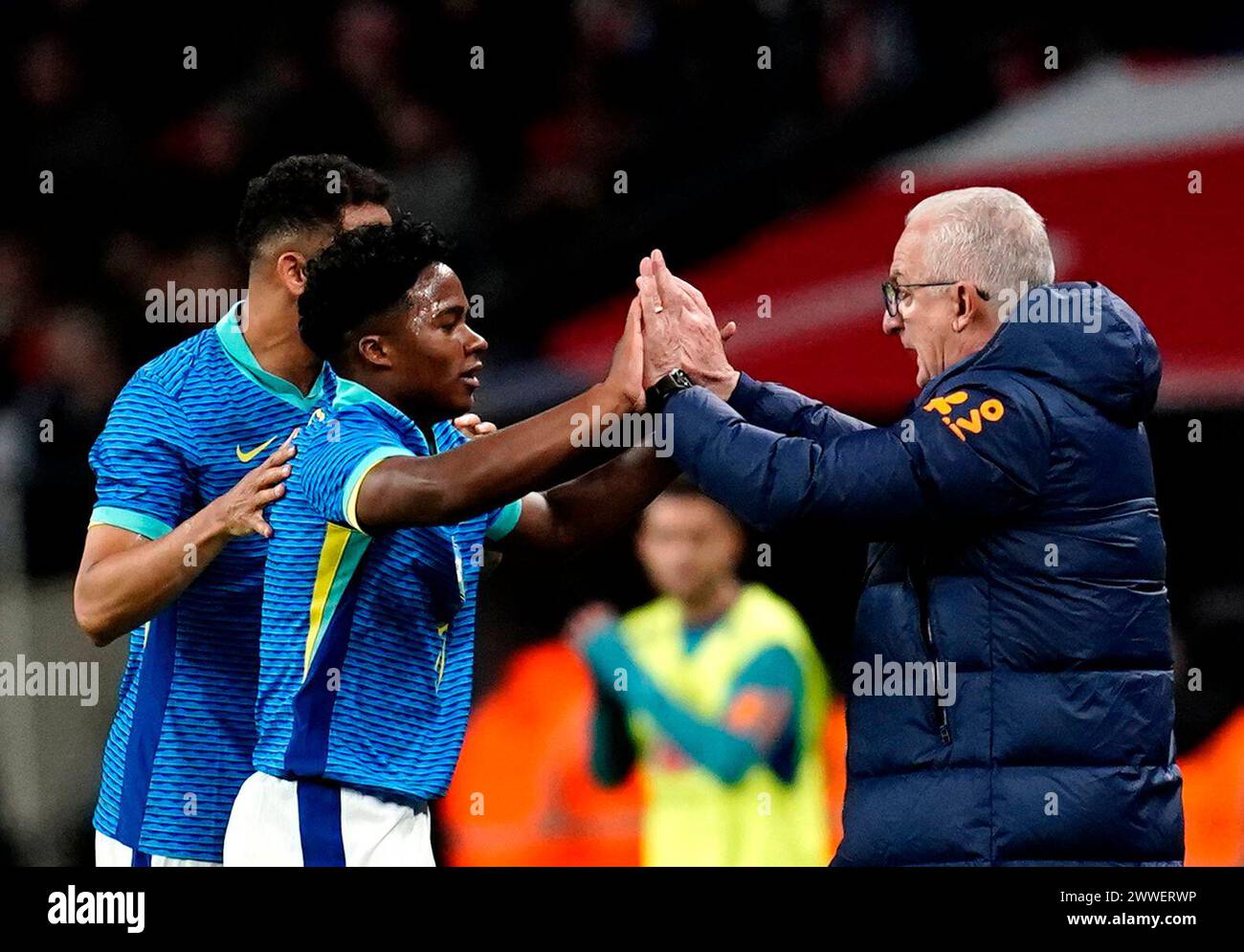 Brazil's Endrick celebrates with manager Dorival Junior after scoring their side's first goal of the game during a international friendly match at Wembley Stadium, London. Picture date: Saturday March 23, 2024. Stock Photo