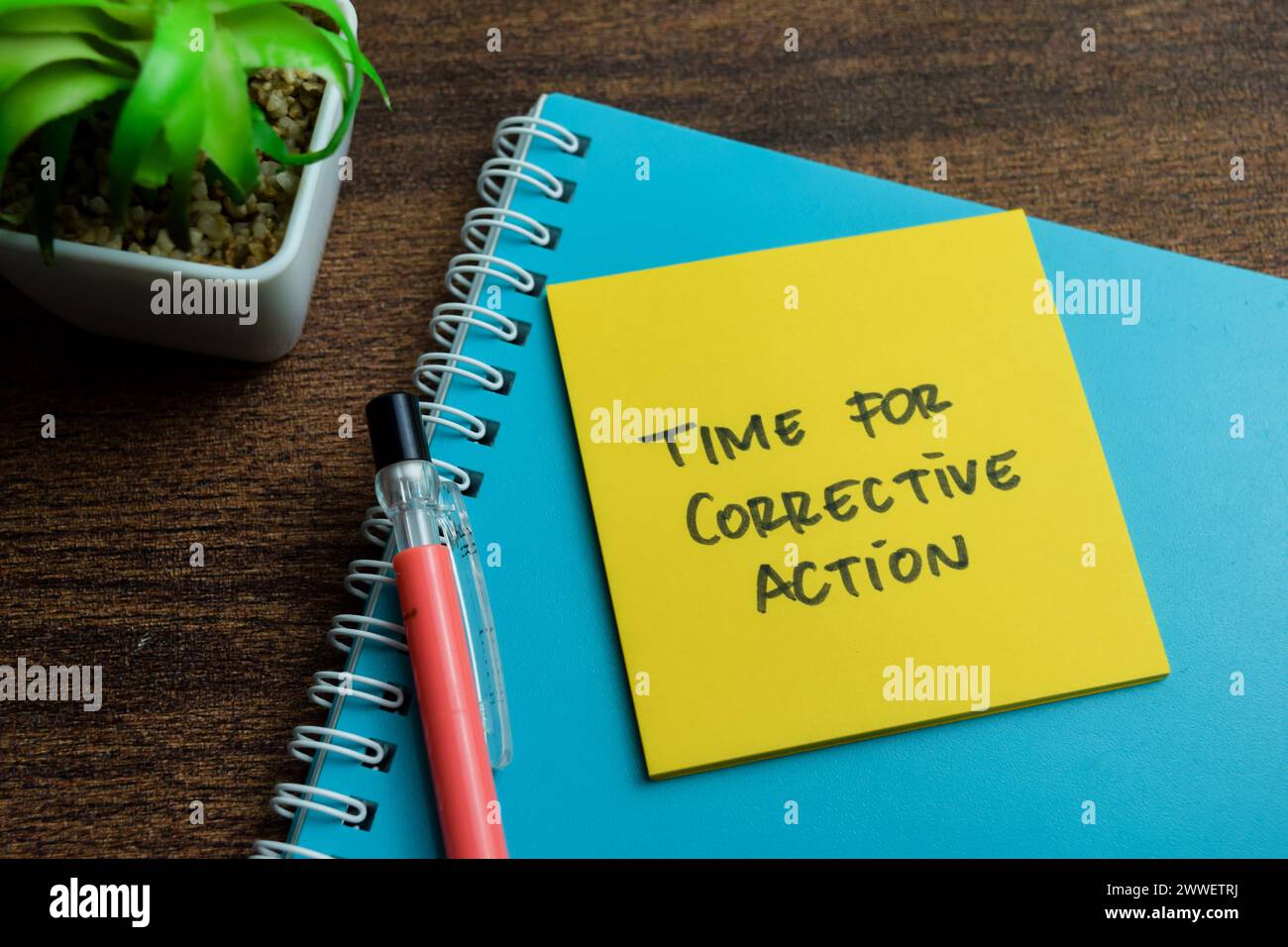 Concept of Time for Corrective Action write on sticky notes isolated on Wooden Table. Stock Photo