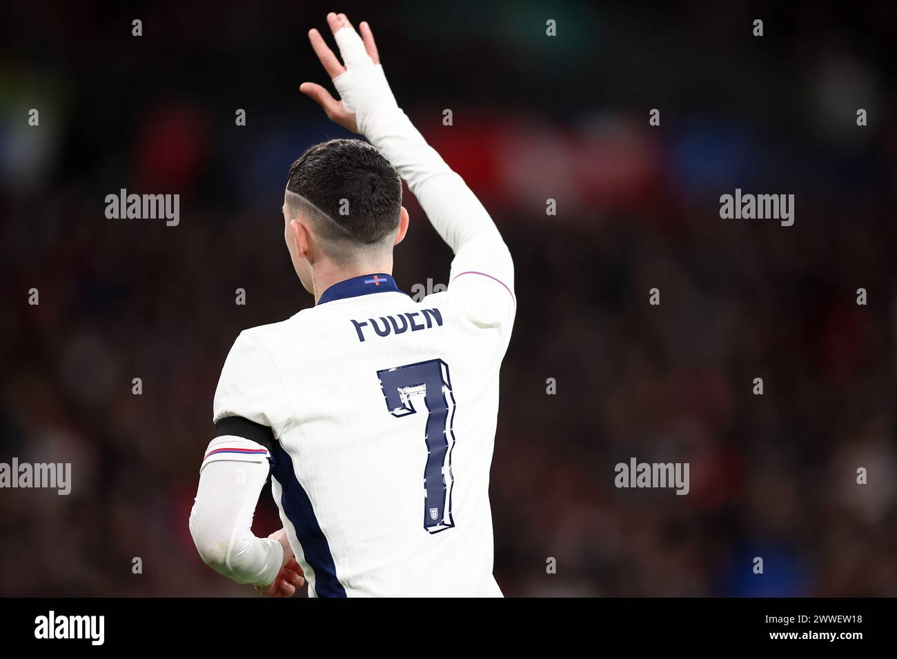 London, UK. 23rd Mar, 2024. The controversial flag on the collar of the England shirt is seen on the back of Phil Foden of England during the International Friendly match between England and Brazil at Wembley Stadium on March 23rd 2024 in London, England. (Photo by Daniel Chesterton/phcimages.com) Credit: PHC Images LTD/Alamy Live News Stock Photo