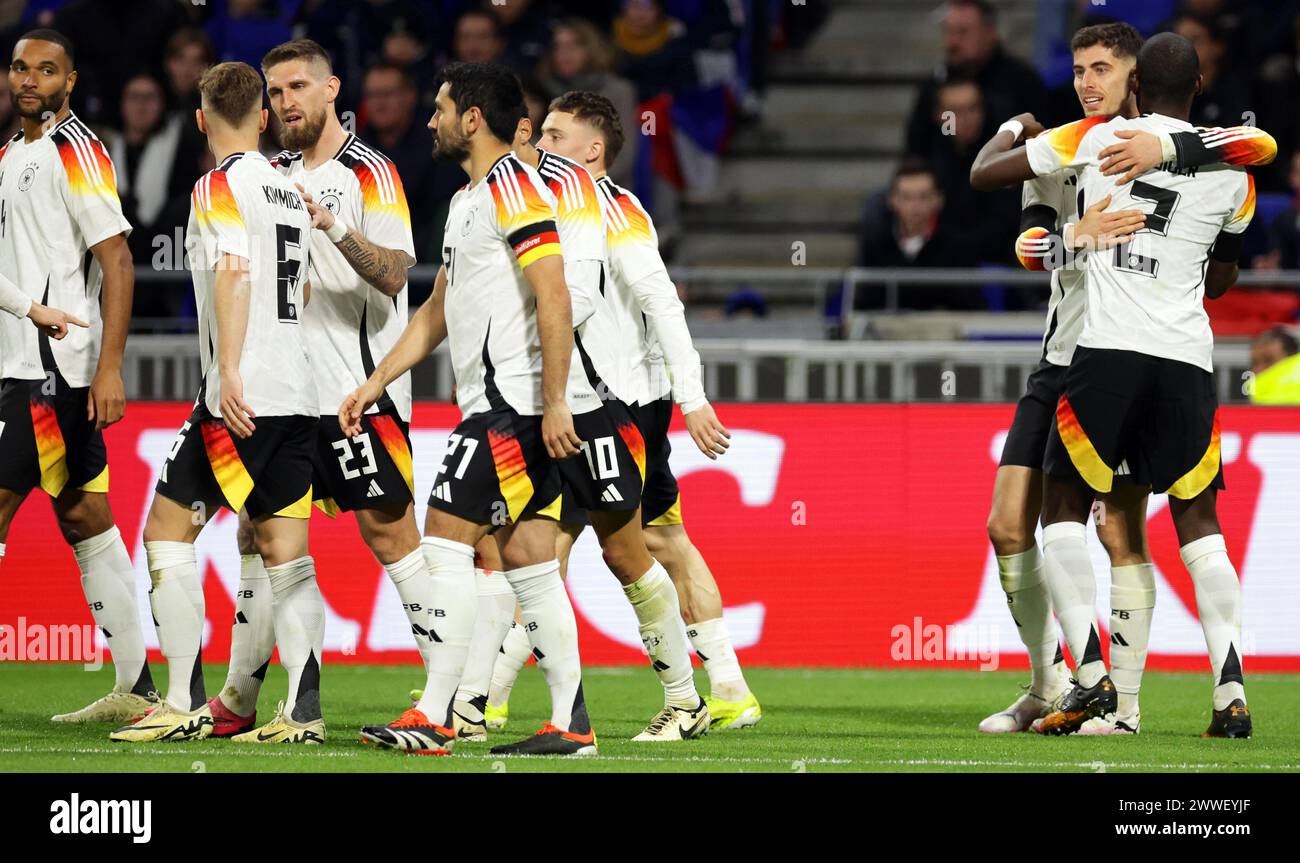Lyon, France. 23rd Mar, 2024. Soccer: International match, France - Germany, Groupama Stadium. Germany's Kai Havertz (2nd from right) celebrates his goal to make it 2-0 with his team-mates. Credit: Christian Charisius/dpa/Alamy Live News Stock Photo