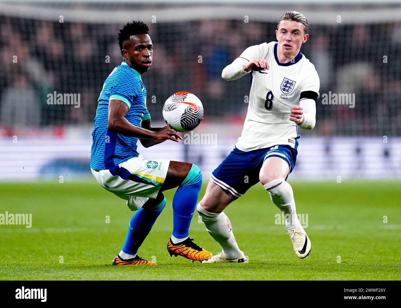 Brazil's Vinicius Junior (left) and England's Conor Gallagher battle for the ball during a international friendly match at Wembley Stadium, London. Picture date: Saturday March 23, 2024. Stock Photo