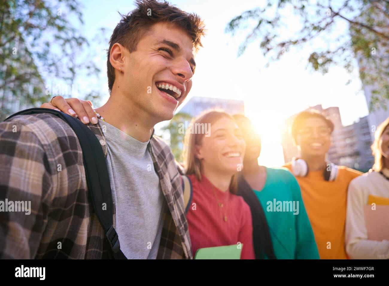 Happy young multiracial university students posing together taking a photo Stock Photo