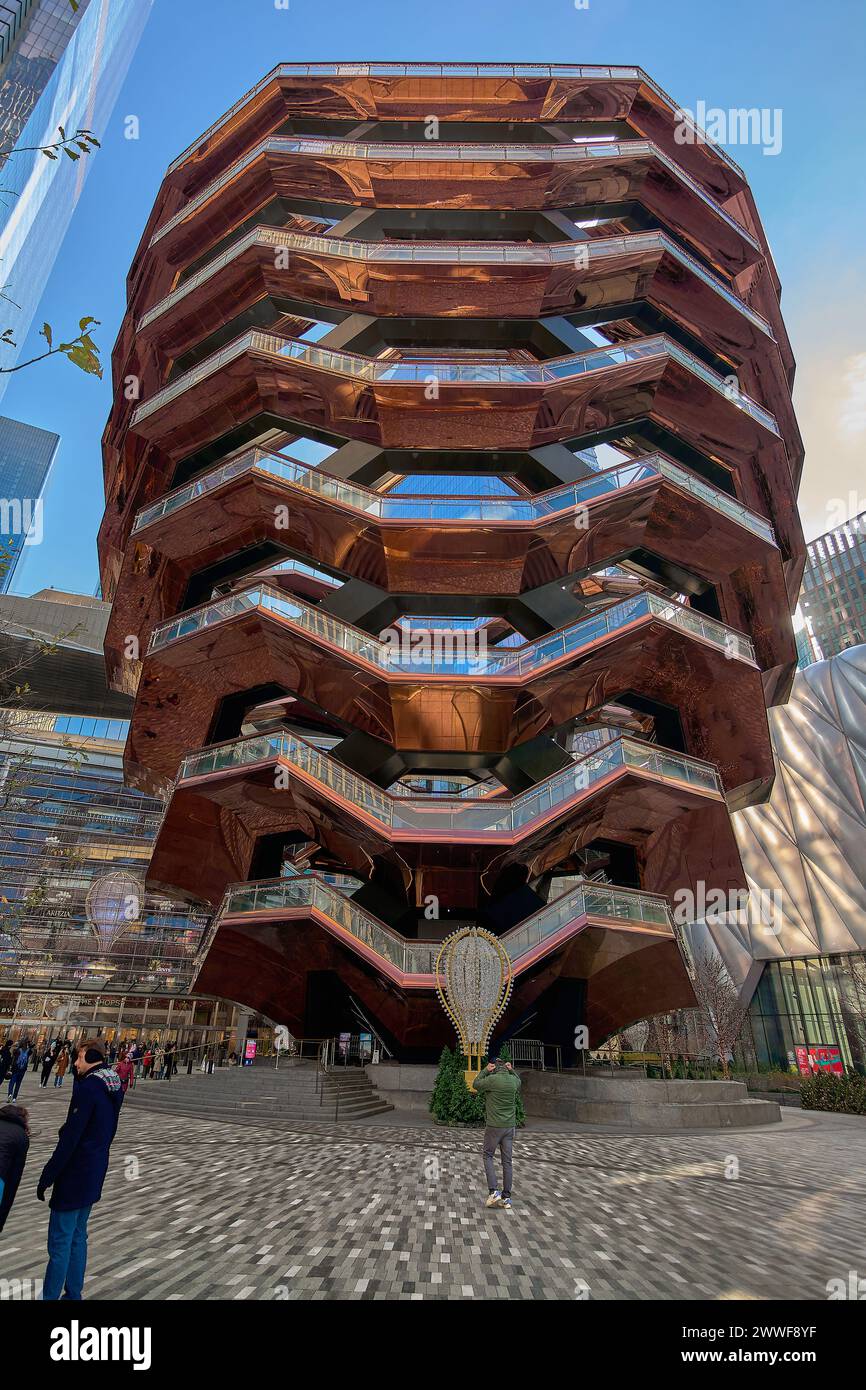 Nueva York, USA - March 23, 2024: Visitors are drawn to the Vessel's captivating structure, a blend of art and architectural innovation. Stock Photo