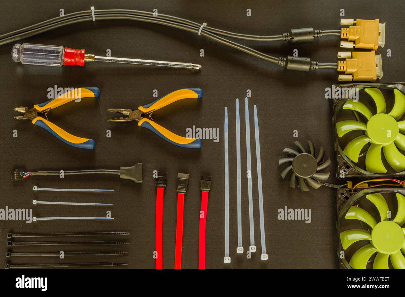 Flat lay of various computer tools and parts on black background Stock ...