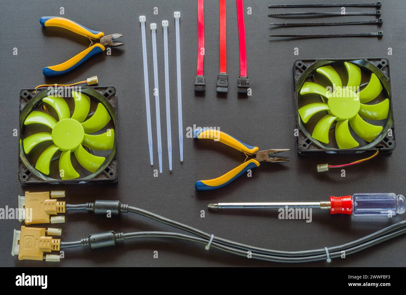 Flat lay of various computer tools and parts on black background Stock ...