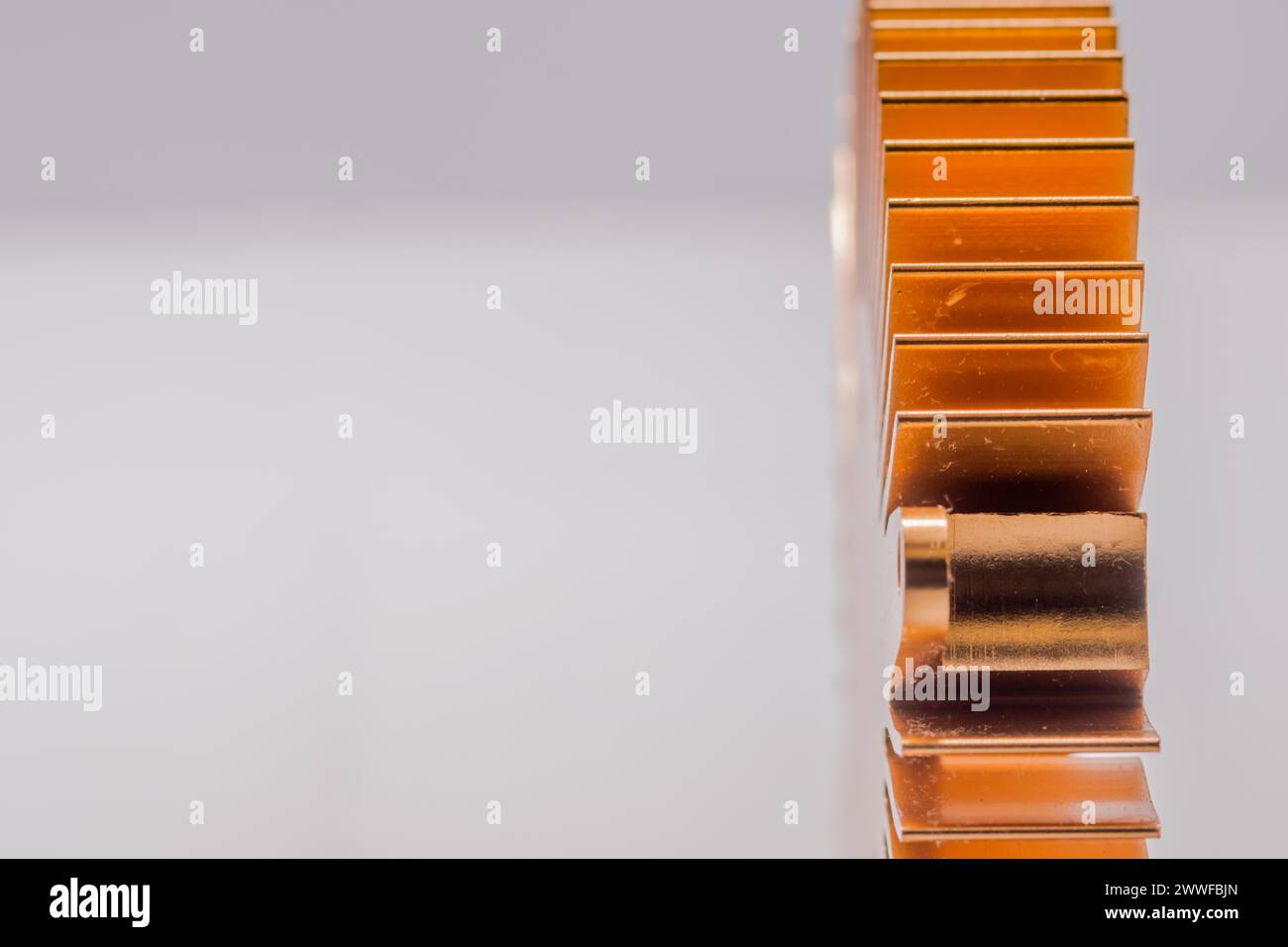 Closeup of copper computer heat sink fins on white background Stock Photo