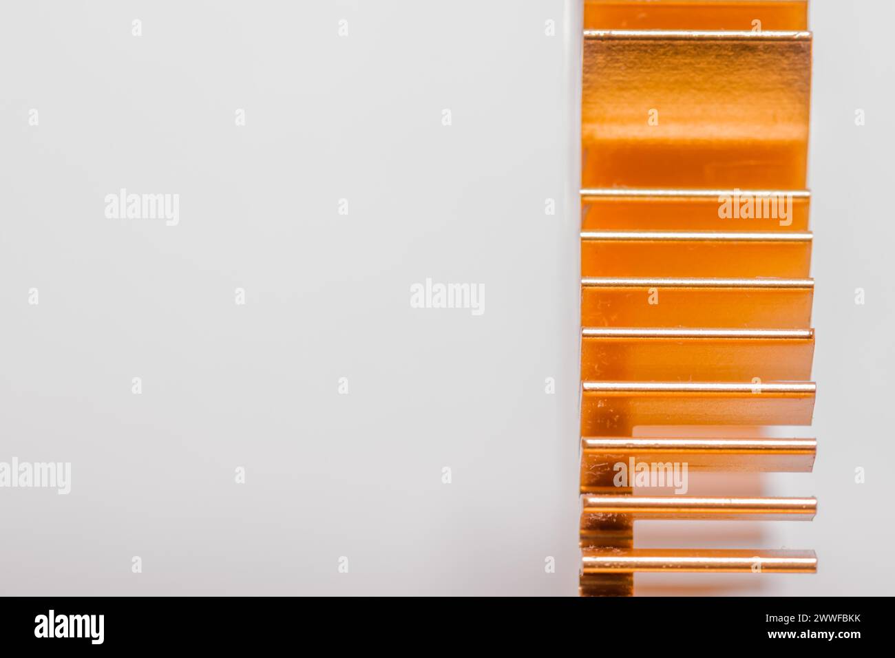 Closeup of copper computer heat sink fins on white background Stock Photo