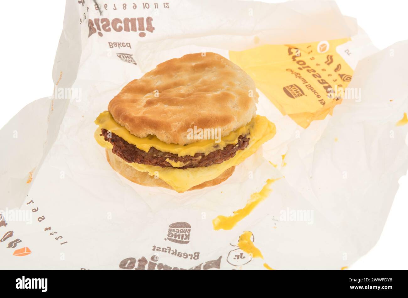Winneconne, WI - 15 March 2024: A package of Burger King breakfast biscuit sandwich sausage, egg and cheese on an isolated background. Stock Photo