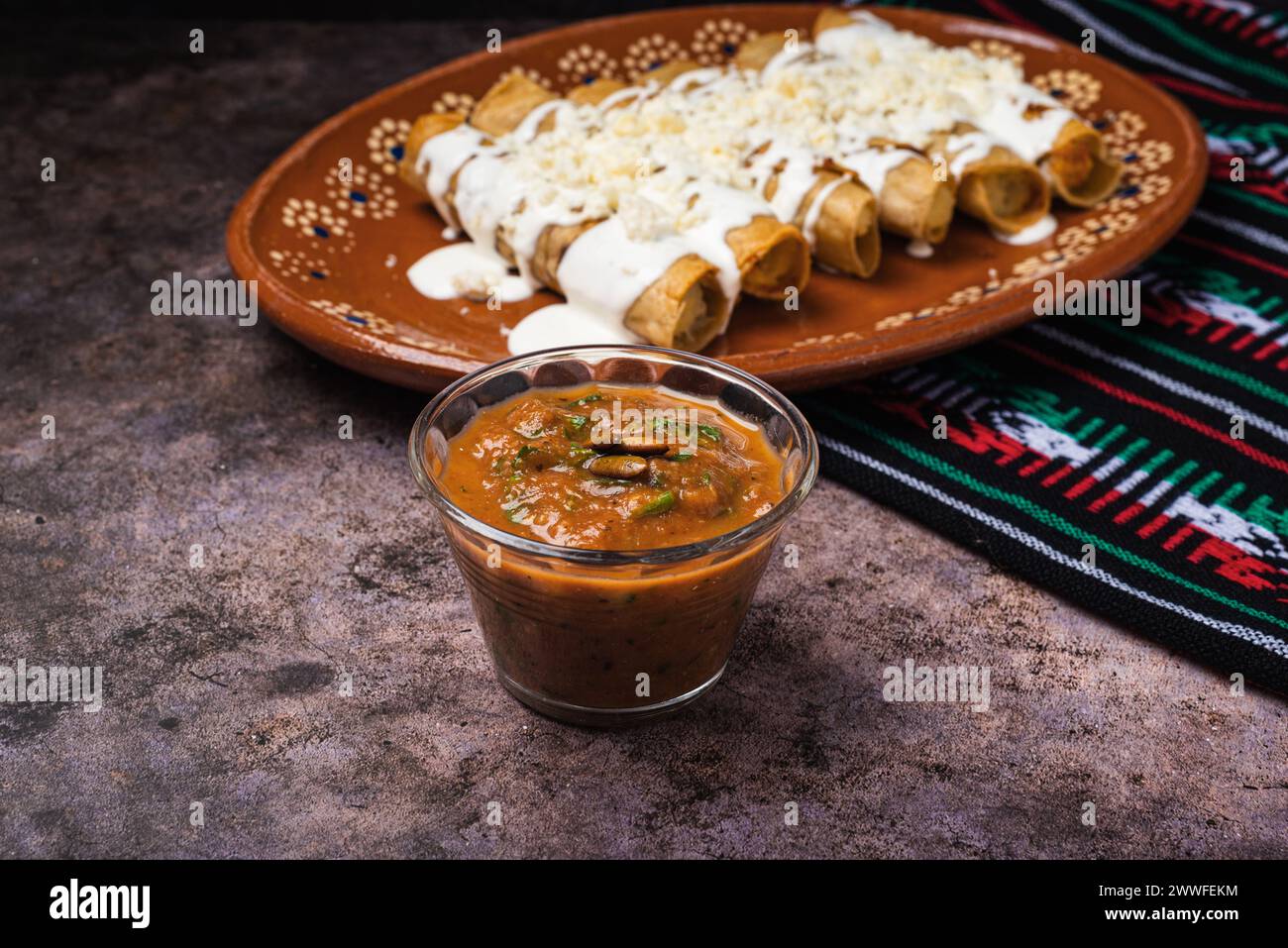 Homemade spicy red sauce for tacos. Traditional Mexican sauce in a