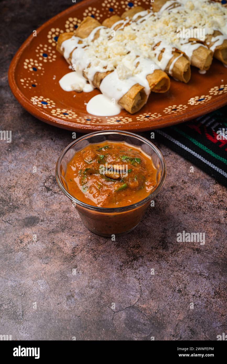 Homemade spicy red sauce for tacos. Traditional Mexican sauce in a