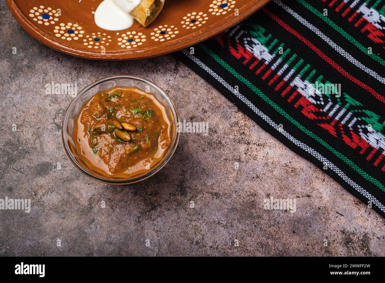 Homemade spicy red sauce for tacos. Traditional Mexican sauce in a