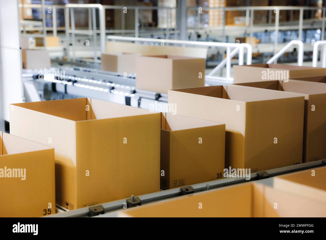 Cartons for dispatch on a conveyor belt in a logistics centre, Cologne, North Rhine-Westphalia, Germany Stock Photo