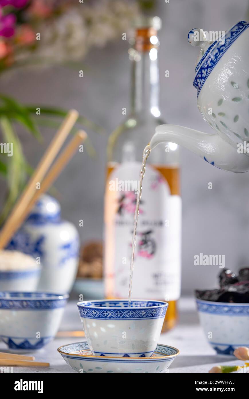 Pouring Tea Pattern Pouring tea, Asian tea set with blue patterns, a bottle of China plum ...