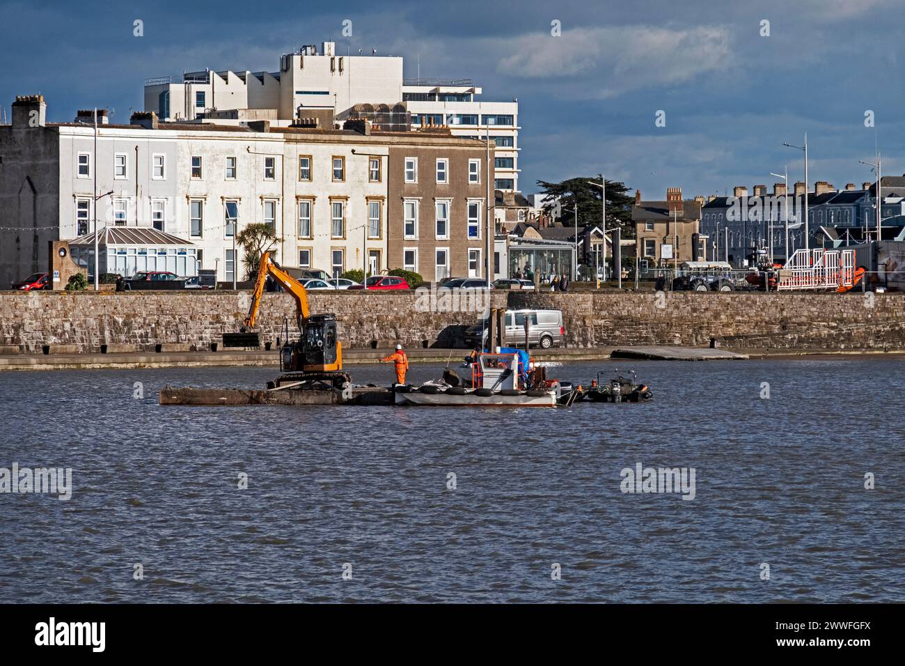Dredging to remove excess mud from the Marine Lake in Weston-super-Mare, UK on 26 February 2024. Weston-super-Mare is situated on the Bristol Channel, which has one of the highest tidal ranges in the world, and regular dredging is required to ensure that the Marine Lake remains usable for swimming. Stock Photo
