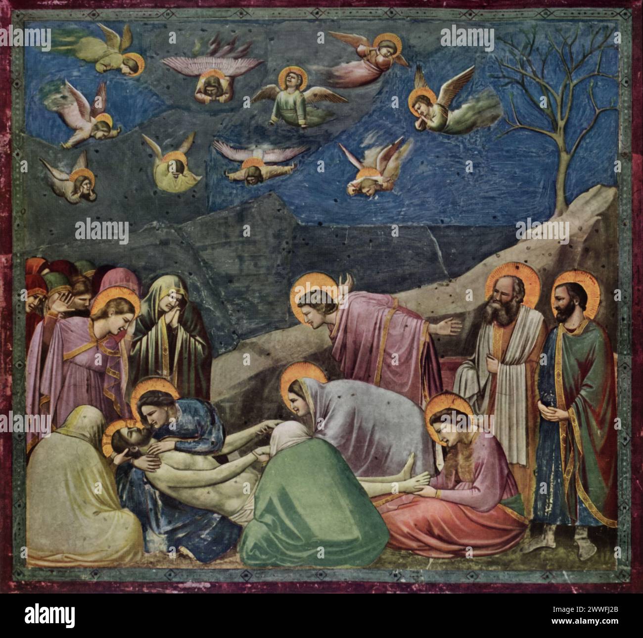 Giotto's 'The Deposition' (early 14th century): Found in the Scrovegni Chapel, Padua, this fresco captures the poignant moment of Christ's lamentation after being taken down from the cross. Renowned for its emotional depth and realistic depiction of grief, Giotto's work marks a significant shift towards humanism in art. The composition, with its focus on human emotion and the innovative use of space, plays a pivotal role in the transition to Renaissance artistry. Stock Photo