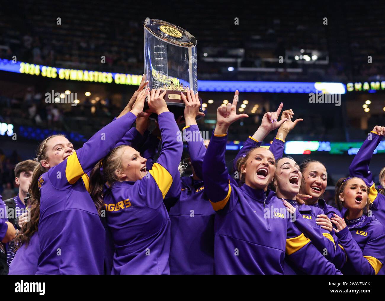 March 23, 2024: The LSU women's gymnastics team holds up the SEC ...