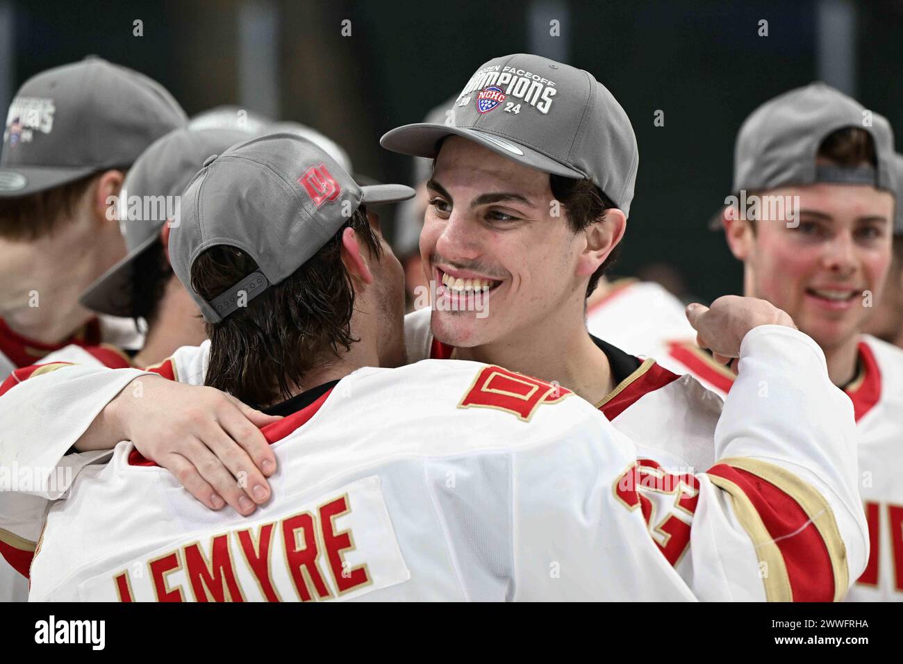 Denver Pioneers forward Tristan Lemyre (29) and Denver Pioneers defenseman Zeev Buium (28) hug after winning the championship game of the NCHC Frozen Faceoff between the University of Nebraska - Omaha Mavericks and the Denver University Pioneers at the Xcel Energy Center, St. Paul, MN on Saturday, March 23, 2024. Denver won 4-1. By Russell Hons/CSM Stock Photo