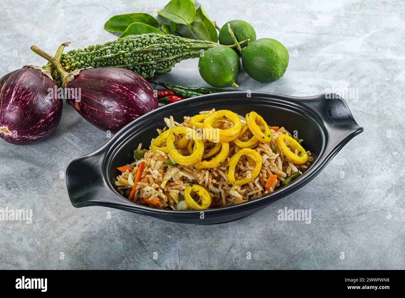 Asian cuisine - Fried rice with squid rings Stock Photo - Alamy