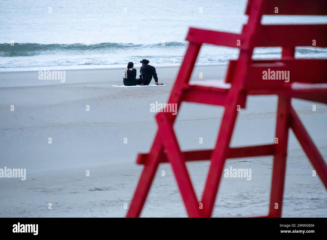 Couple enjoying the early morning solitude at Jacksonville Beach in Northeast Florida. (USA) Stock Photo