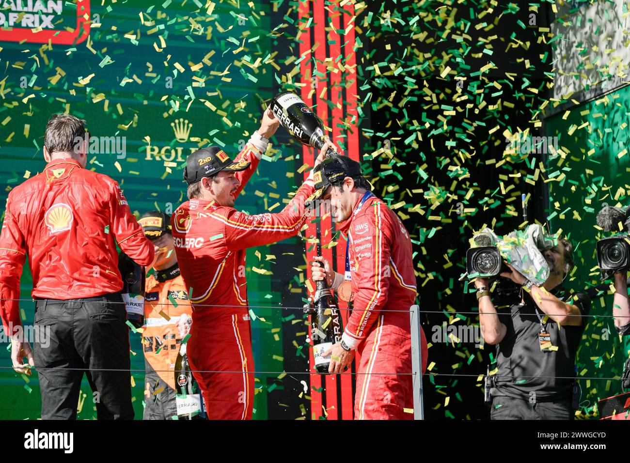 MELBOURNE, AUSTRALIA. 24th March 2024. 16 Charles Leclerc (MCO) Scuderia Ferrari pours champagne onto Australian Grand Prix winner 55 Carlos Sainz Jr. (ESP) Scuderia Ferrari (right) podium celebration following the completion of the FIA Formula 1 Rolex Australian Grand Prix 2024 3rd round from 22nd to 24th March at the Albert Park Street Circuit, Melbourne, Australia. Credit: Karl Phillipson/Alamy Live News. Stock Photo