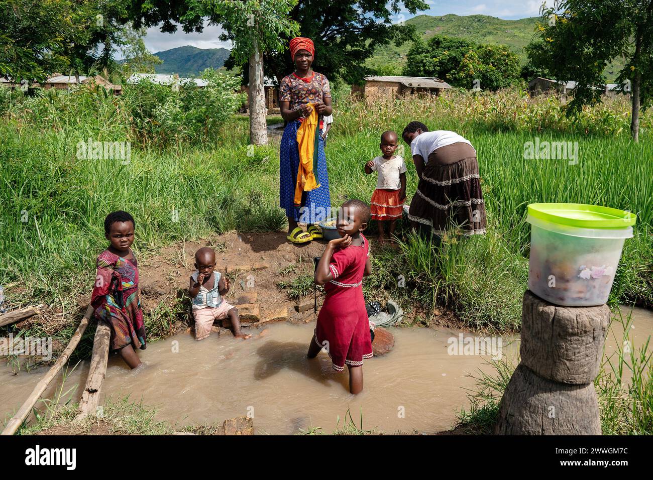 Women wash clothes clothes in the flooding-prone regions around Lake Chilwa in the Machinga district of Malawi. Picture date: Tuesday March 5, 2024. Stock Photo