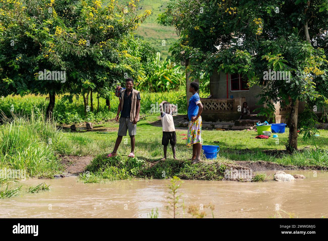 People near their homes in the flooding-prone regions around Lake Chilwa in the Machinga district of Malawi. Trocaire is training farmers in new diverse crops that can tolerate weather extremes a little more than maize can. Picture date: Tuesday March 5, 2024. Stock Photo