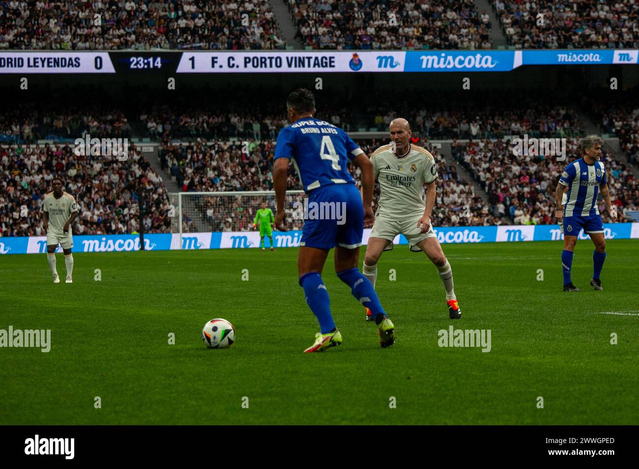 Madrid, Spain. 23rd Mar, 2024. Bruno Alves (L) and Zinedine Zidane (R) seen in action during the Corazón Classic Match between Real Madrid Legends and FC Porto Vintage at Santiago Bernabéu Stadium. Final score; Real Madrid Legends 0:1 FC Porto Vintage. Credit: SOPA Images Limited/Alamy Live News Stock Photo