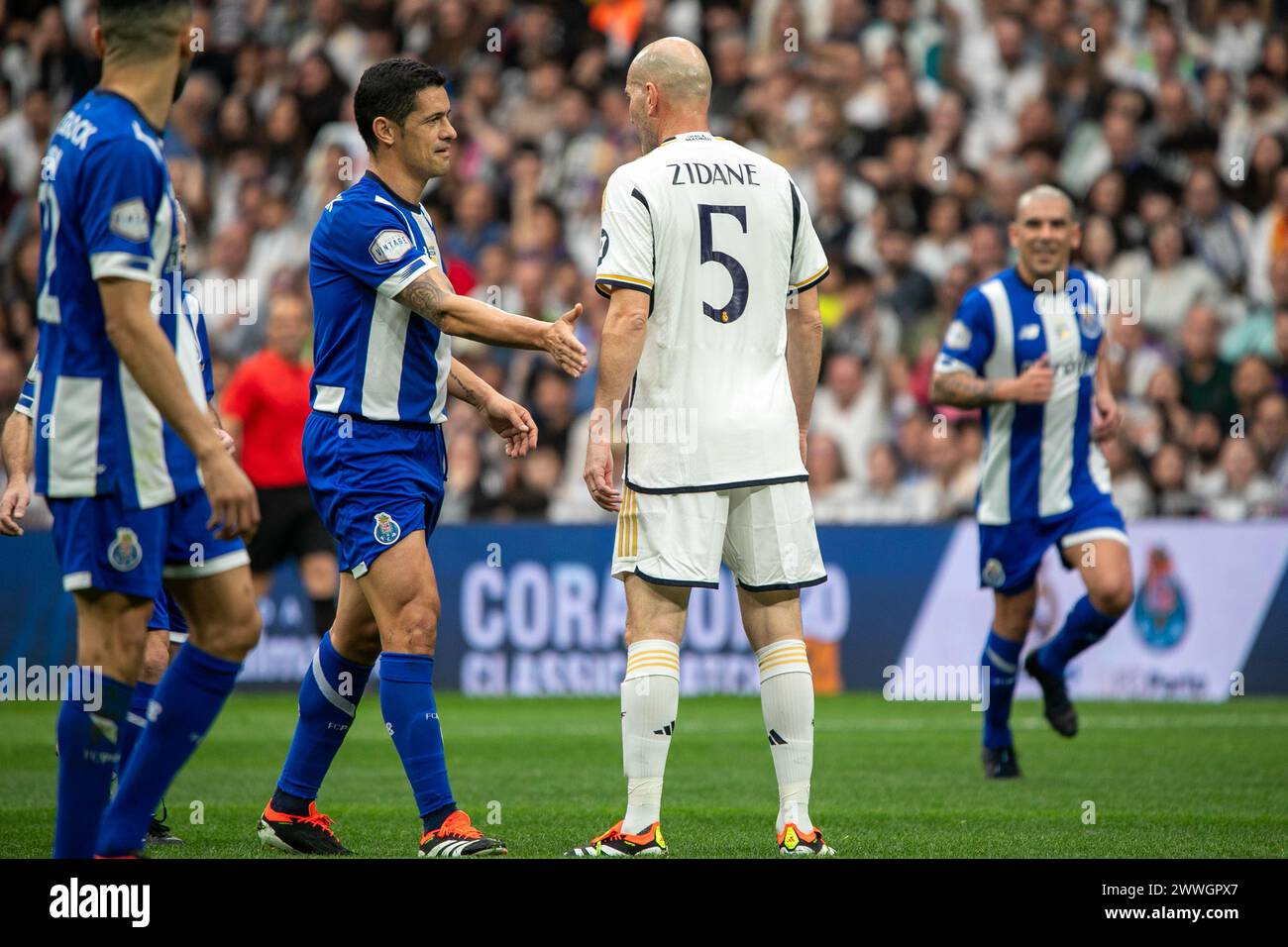 Madrid, Spain. 23rd Mar, 2024. Ricardo Costa (L) shake hands with Zinedine Zidane (R) during the Corazón Classic Match between Real Madrid Legends and FC Porto Vintage at Santiago Bernabéu Stadium. Final score; Real Madrid Legends 0:1 FC Porto Vintage. Credit: SOPA Images Limited/Alamy Live News Stock Photo
