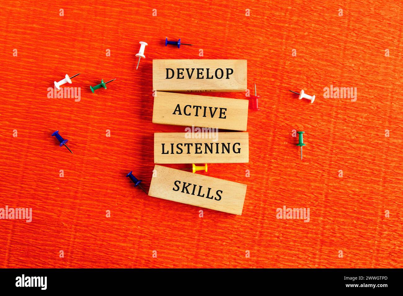Concept word Develop active listening skills on wooden blocks. Bright ...