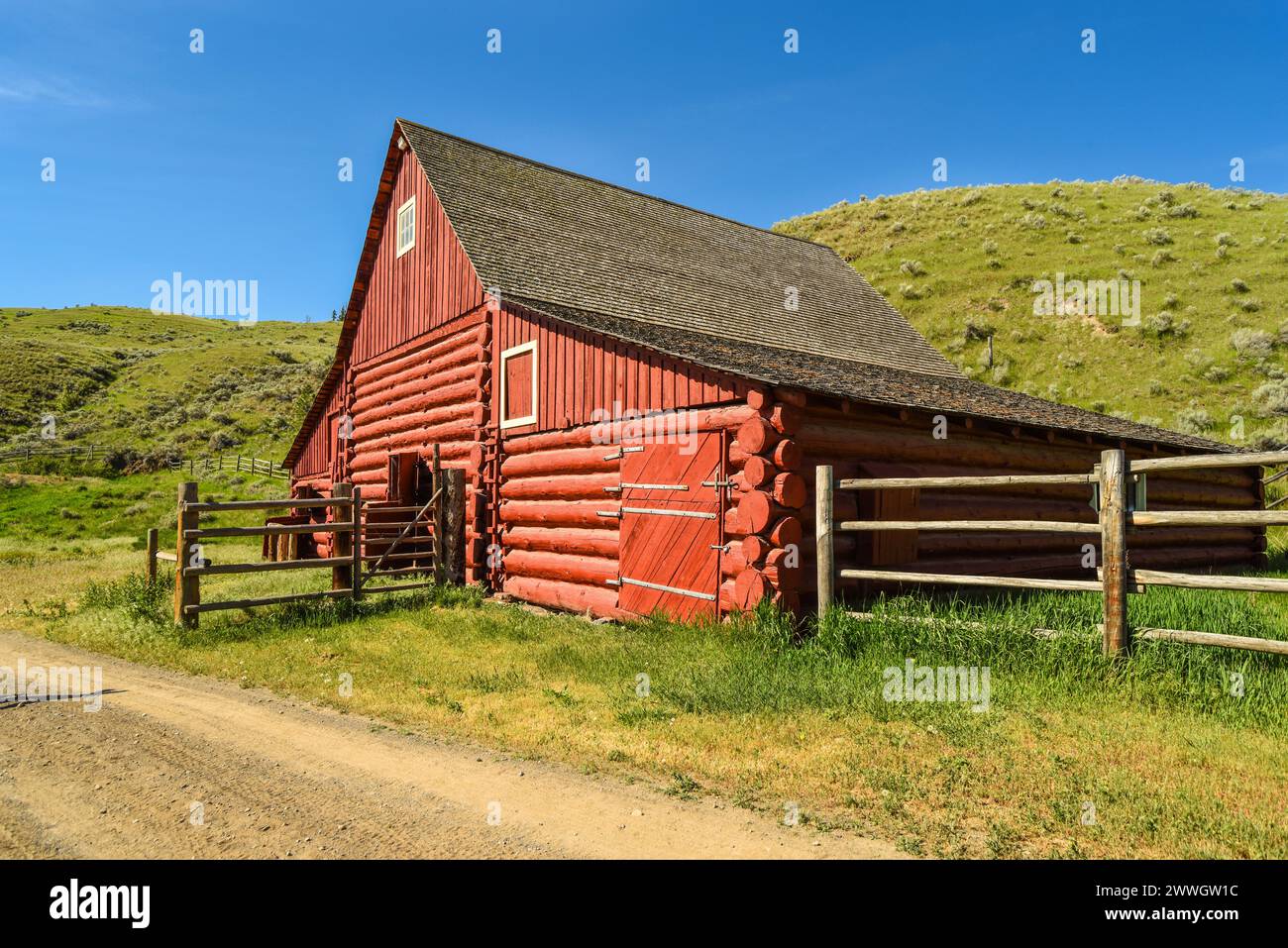 Old red barn under blue sky, Canada Stock Photo