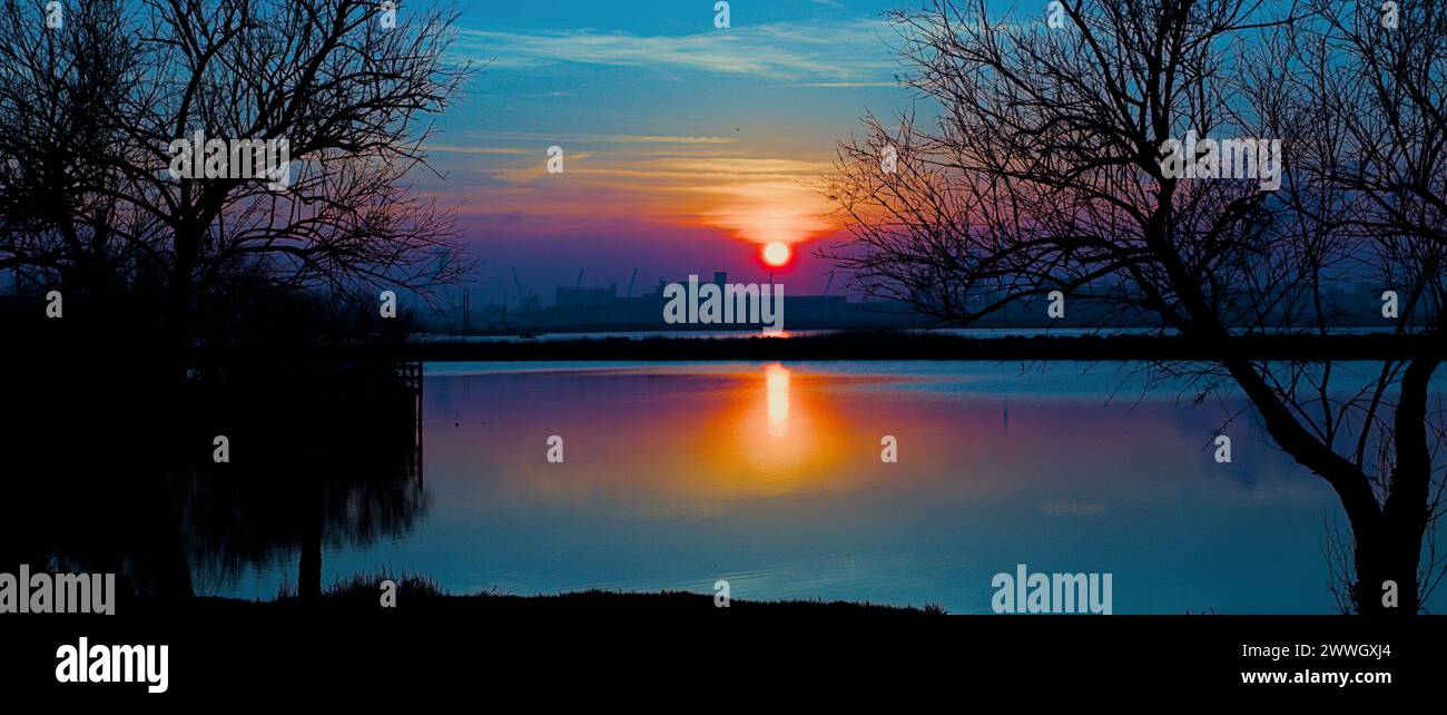 Sunset at Pialassa Piomboni (Marina di Ravenna, Italy) Stock Photo