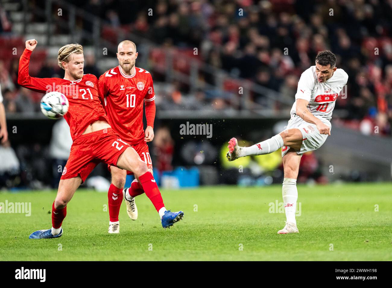 Copenhagen, Denmark. 23rd Mar, 2024. Morten Hjulmand (21) of Denmark and Granit Xhaka (10) of Switzerland seen during the football friendly match between Denmark and Switzerland at Parken in Copenhagen. (Photo Credit: Gonzales Photo/Alamy Live News Stock Photo