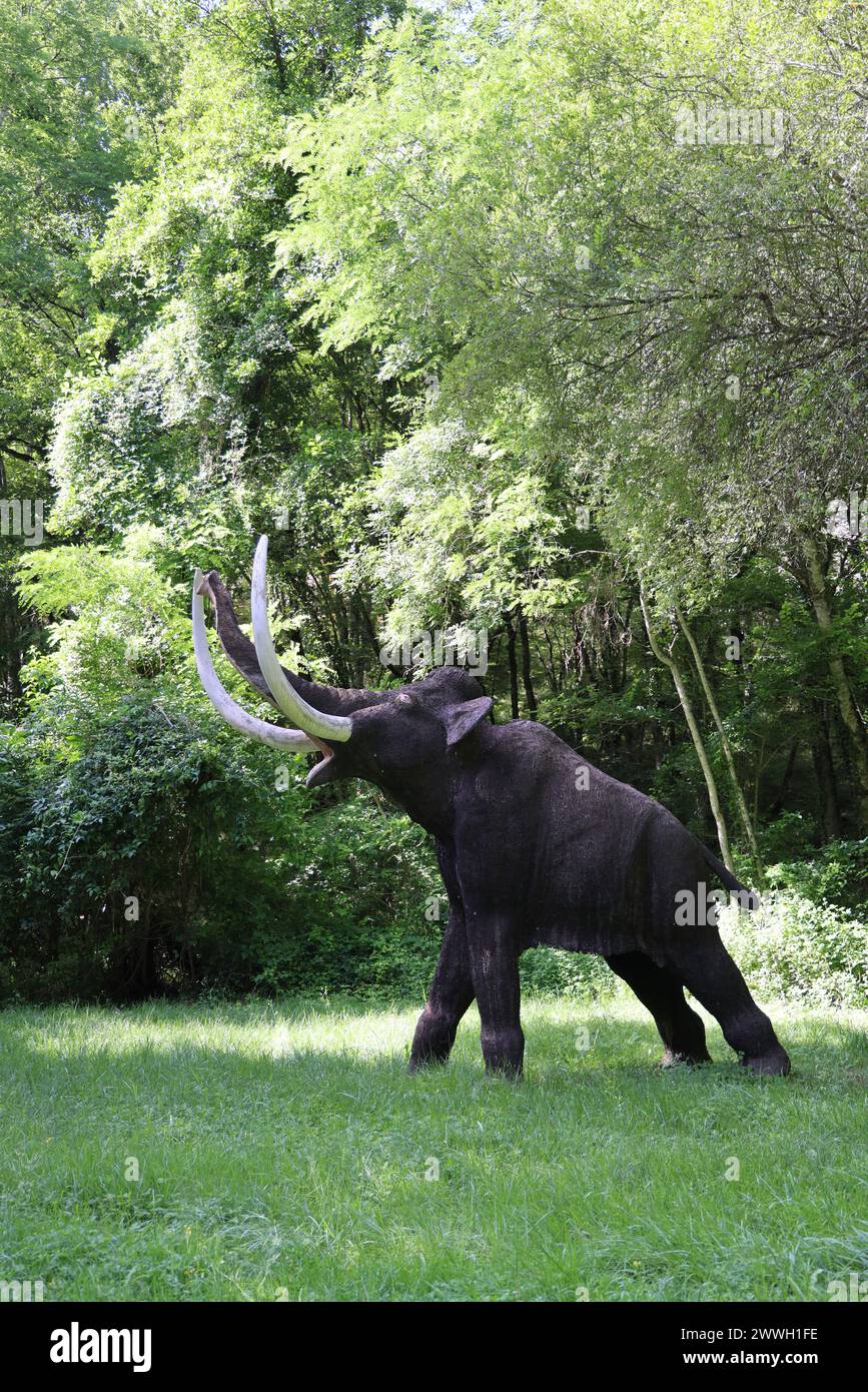 Hunting during prehistory: Mammoths and reconstructed mammoth hunting at the Prehisto Parc in the Vézère River Valley in Périgord Noir. Tursac, Périgo Stock Photo