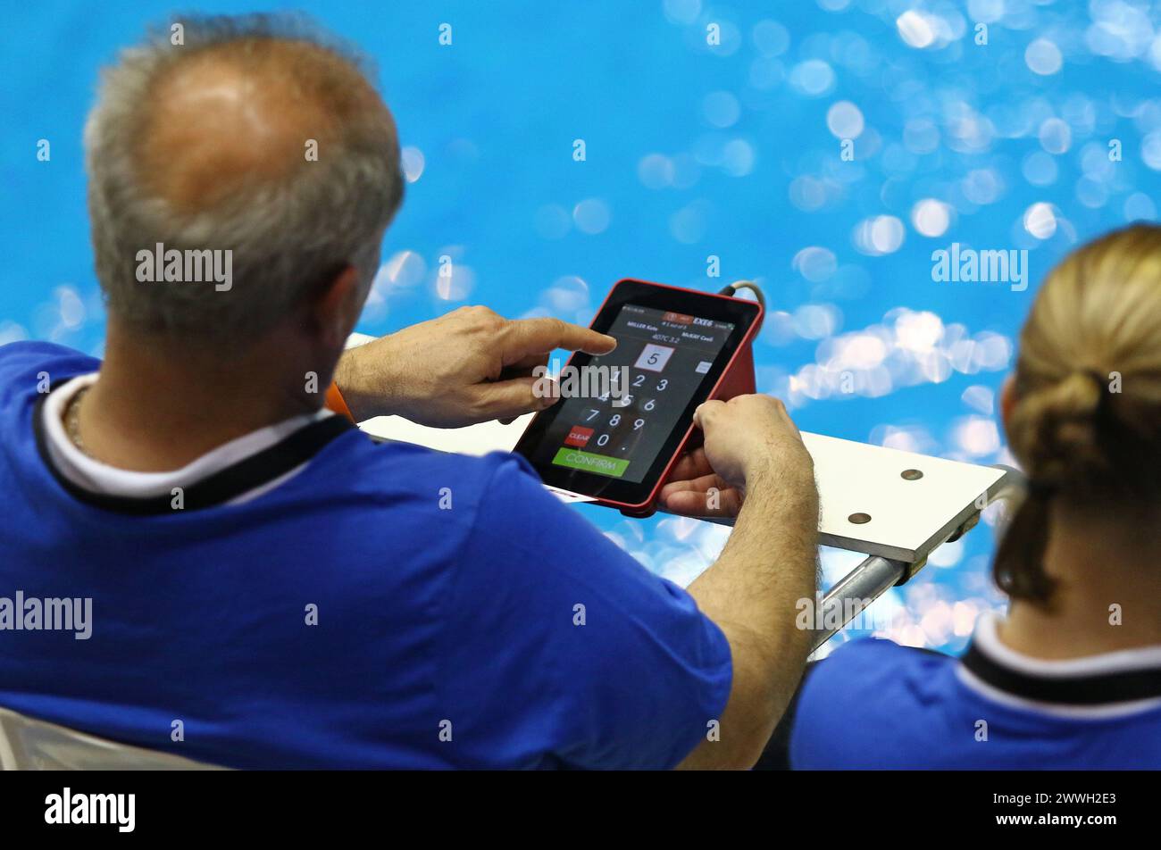 Berlin, Germany March 22, 2024 Diving referee rates a dive during