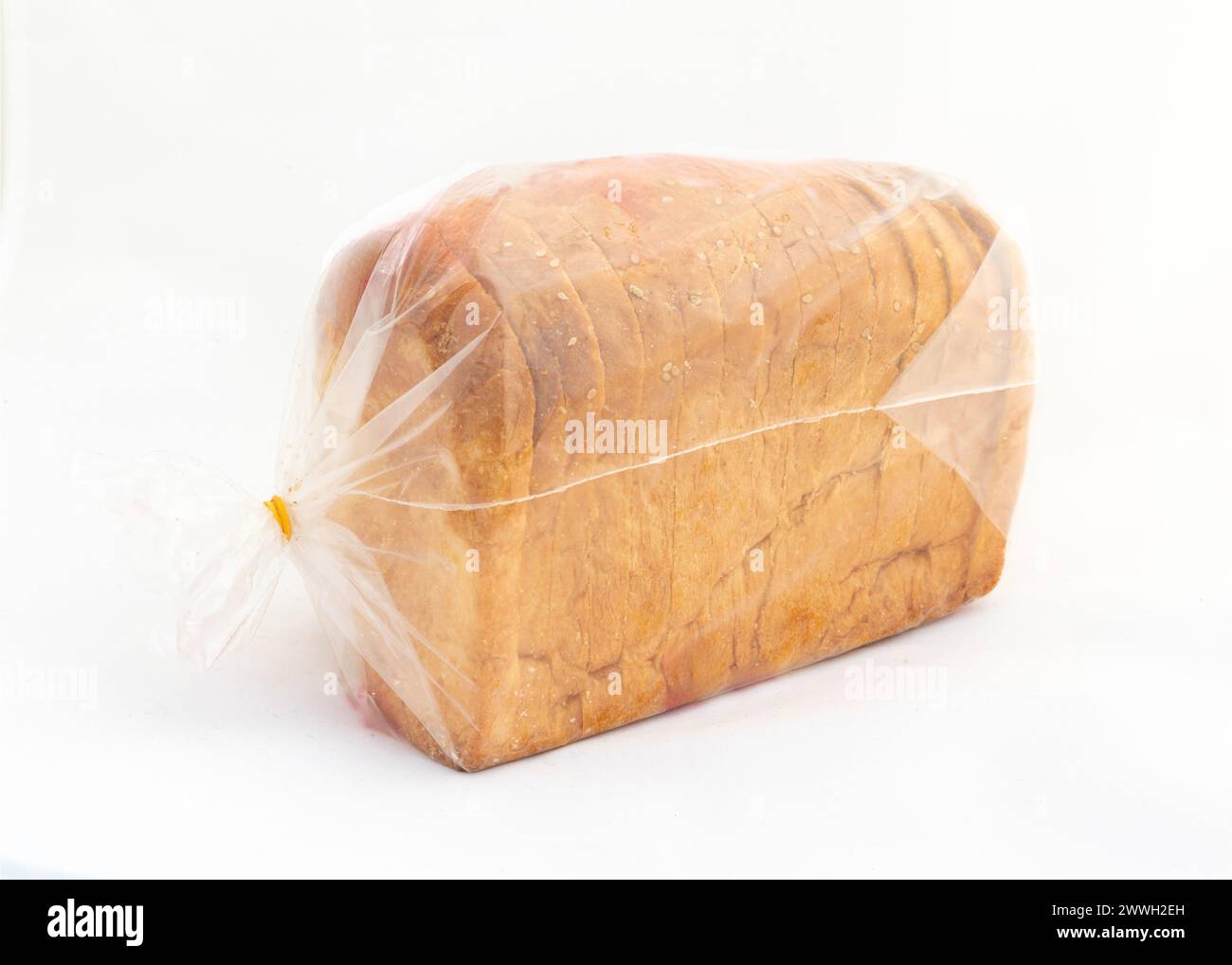 White sliced bread in a plastic packet on white isolated background Stock Photo